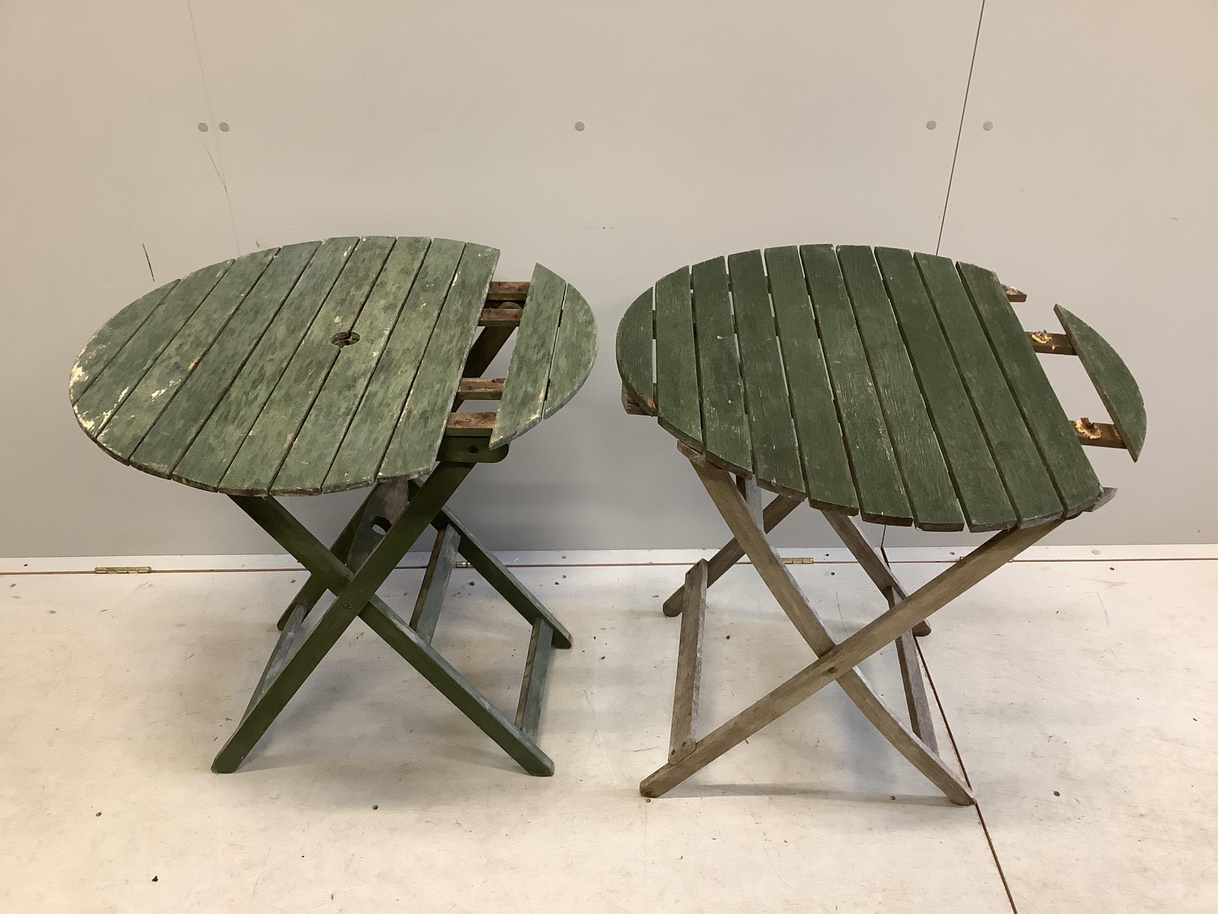 Two slatted wood folding garden tables and four chairs. Condition - very poor